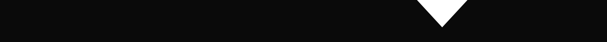 White triangular shape on a black background, pointing downward.